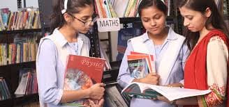 Girls learning together in a classroom